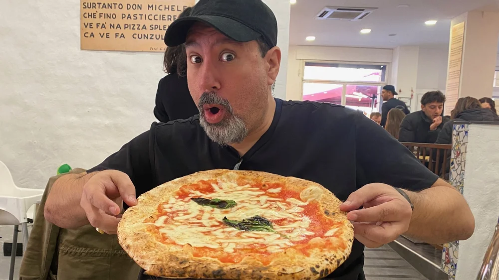 Dave with a pizza in Italy