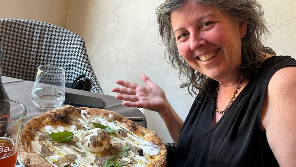 Kelly with her favorite pizza in Florence